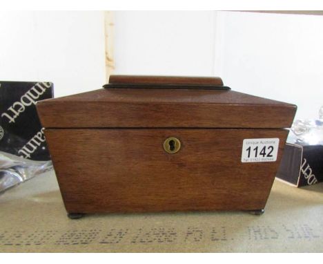 A mahogany sarcophogus tea caddy
