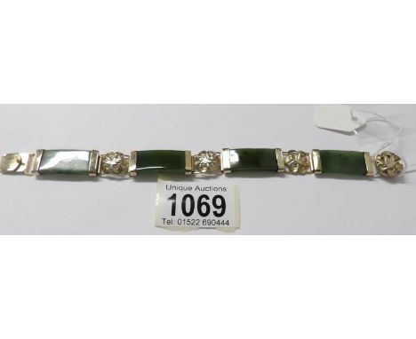 A jade and floral gilt bracelet
