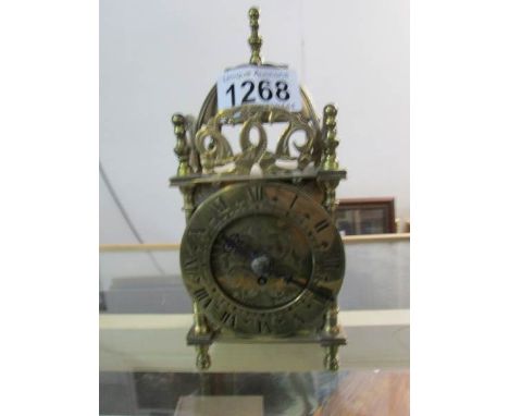 A brass lantern clock