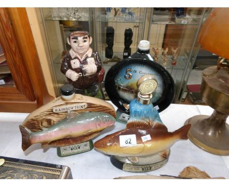 4 ceramic advertising decanters, one missing stopper