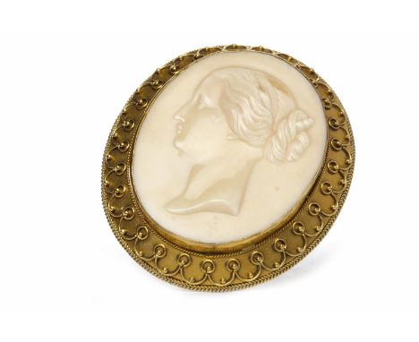 VICTORIAN CERAMIC CAMEO BROOCHthe large oval cameo 46mm high and depicting a female in profile facing left, the gold coloured