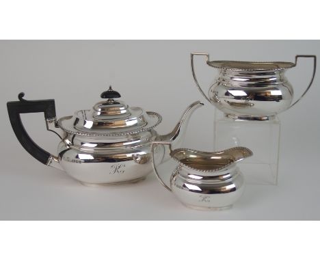 A THREE PIECE SILVER TEA SERVICE BY ELLIS &amp; CO London 1923, of rounded rectangular shape with gadrooned border, each piec