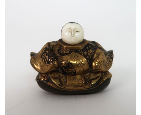 A JAPANESE LACQUERED NETSUKE FIGURE seated and wearing elaborate gilt costume, 2.5cm high Condition Report: Available upon re