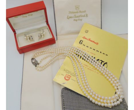 A THREE STRAND OF MIKIMOTO PEARLS AND EARRINGS retailed by Lane Crawfords of Hong Kong, with original packaging and leaflet c