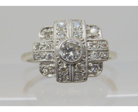 A VINTAGE DIAMOND CLUSTER RING mounted in 18ct white gold and platinum, and set with estimated approx 0.44cts of old and eigh