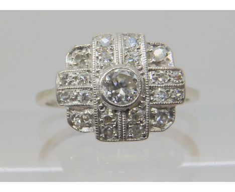 A VINTAGE DIAMOND CLUSTER RING mounted in 18ct white gold and platinum, and set with estimated approx 0.44cts of old and eigh