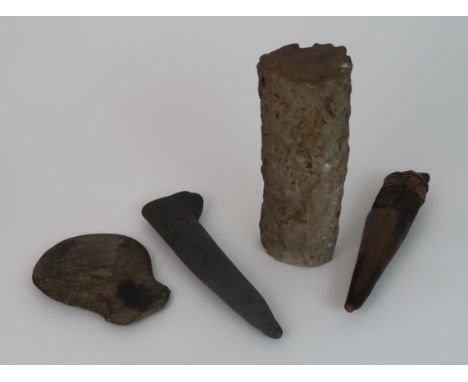 A SOUTH SEA ISLANDS STONE SHORT FIGHTING CLUB with carved banding to base and hole drilled for a cord, 27cm long, flattened s