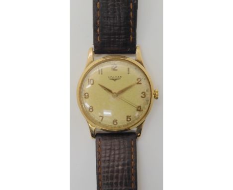 A 9CT GOLD GENTS LONGINES WRISTWATCH with gold coloured face, hands and Arabic numerals, inscribed verso with the date 1967, 