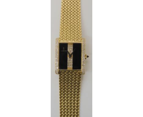 AN 18CT GOLD, ONYX AND DIAMOND CORUM WRISTWATCH with integral woven strap and gem set crown, dimensions of the case 2.3cm x 2