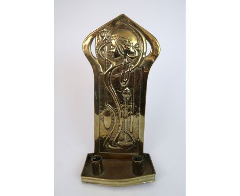 ATTRIBUTED TO AGNES BANKIER HARVEY (1873-1947) a brass wall sconce, circa 1900 of rectangular form, relief decorated with an 