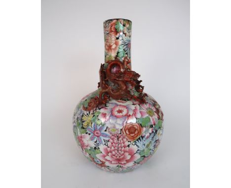 A CANTON MILLIEFIORI BALUSTER VASE painted all over with flowers and applied with a dragon chasing the golden pearl of wisdom