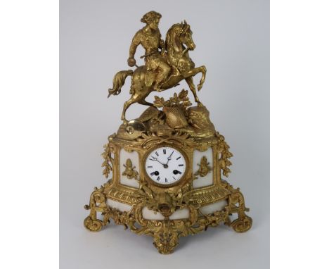 A FRENCH ALABASTER AND ORMOLU MOUNTED MANTLE CLOCK the whole decorated with a knight on horseback, the white dial with roman 