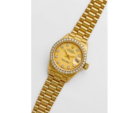Damenarmbanduhr von Rolex-"Datejust" aus den 1980er JahrenGelbgold, gest. 750. Rundes Uhrengehäuse, Lünette mit Brillanten vo