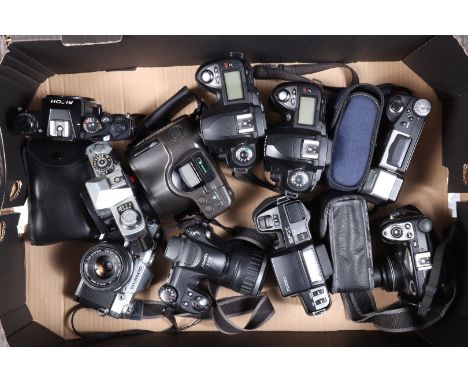 A Tray of Various Cameras, comprising two Nikon D70 SLR bodies, an Olympus OM30 SLR camera, a Minolta XG2 SLR body, a Pentax 