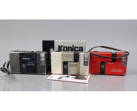 Three Konica Auto Focus AA-35 Cameras, one gold, body VG, shutter working, flash working, in maker's box with manual, one bla