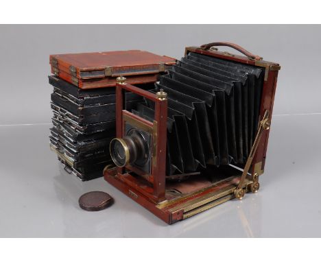 A Ross Mahogany and Brass Half Plate Field Camera, body F, square-cornered black bellows, double extension, rising and tiltin