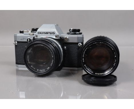 An Olympus OM-10 SLR Camera,  shutter working, meter responsive, self timer working, body G, with a Zuiko 50mm f/1.8 lens, ba