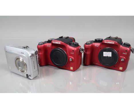 Two Panasonic G2 Digital Camera Bodies, red, both power up, shutters working, appear to function as should, bodies G, light w