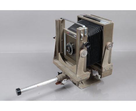 A Kodak Specialist 3 Camera, 4¾ x 6½in format, body G, some pitting, some wear, bellows G, with reversable back, focusing scr