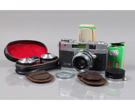 A Petri 2.8 Color Corrected 35mm Rangefinder Camera, shutter slugish on slow speeds, view finder clear, rangefinder functions