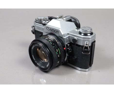 A Canon AE-1 SLR Camera, serial no 4731683, shutter working, meter responsive, self timer working, body G, very light wear, w