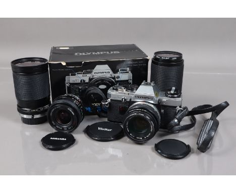 An Olympus OM-10 SLR Camera,  shutter working, meter responsive, self timer working, body G, with Zuiko 50mm f/1.8 lens, barr