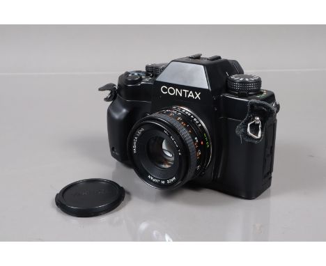 A Contax RX SLR Camera, serial no 028621, shutter working, meter responsive, body G, light wear, with Yashica 50mm f/2 ML len