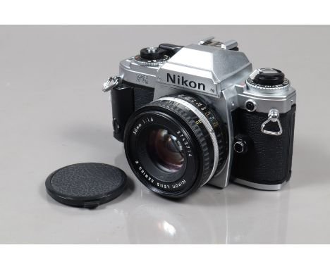 A Nikon FG SLR Camera, serial no 8228751, shutter working, meter working, self timer working, body G-VG, with Series E 50mm f