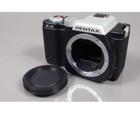 A Pentax K-01 Digital Camera Body, black, powers up, shutter working, flash working, appears to function as should, body G, l