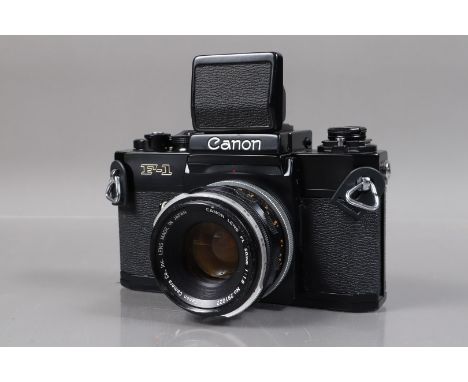 A Canon F-1n SLR Camera, serial no 596060, shutter working, self timer working, with waist level finder, meter not visible, b