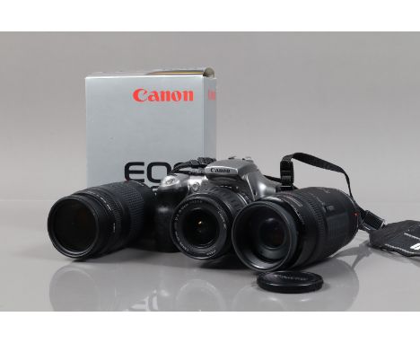 Canon EOS Cameras and Lenses, a Canon EOS 300D DSLR camera, powers up, shutter working, body P, tacky grip, with EFS 18-55mm 