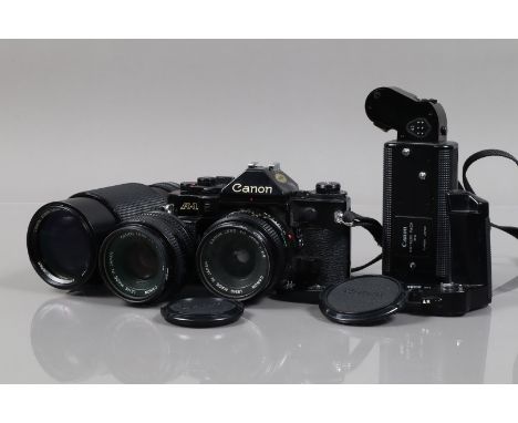 A Canon A-1 SLR Camera Outfit, black, serial no 1528670, shutter working, meter responsive, self timer working, body G, light