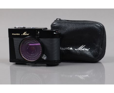 A Fujica Mini Half Frame Camera, shutter working, selenium meter responsive, body G-VG, with 25mm f/2.8 lens, elements G-VG, 