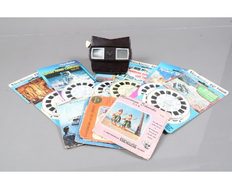 A Veiwmaster Model E Viewer and Reels, a Viewmaster model E viewer, with unopend 3D reels, like The Space Shuttle, Apollo Moo