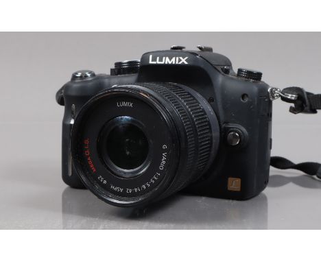 A Lumix G10 Digital Camera, powers up, shutter working, appears to function as should, with G Vario 14-42mm f/3.5-5.6 lens, a