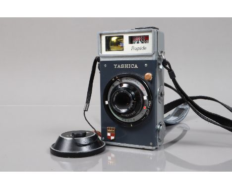 A Yashica Rapide Vertical Half Frame 35mm Camera, shutter working, meter responsive, self timer working, body G, small chip t