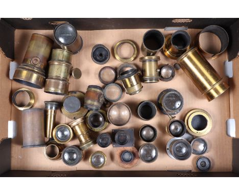 A Tray of 19th Century Brass Lenses and Lens Barrels, 20 approx examples of various Petzval, magic lantern, view camera and t