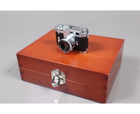 A Minox Digital Classic Leica M3 Camera, 1.3 megapixel, untested, body VG-E, elements VG-E, in display case, with USB cable, 