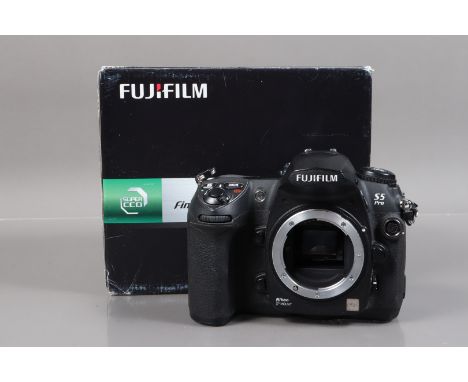 A Fujifilm S5 Pro DSLR Camera, powers up, shutter working, appears to function as should, body G, light wear, with battery an