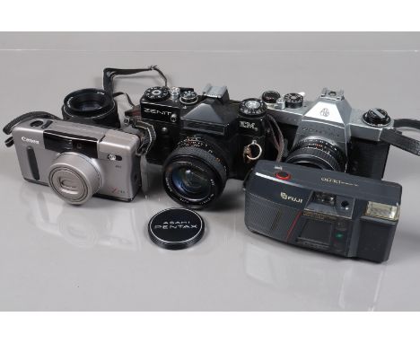 A Group of 35mm Cameras, a Pentax Spotmatic F, shutter working, meter unresponsive, self timer working, body G, with SMC Taku