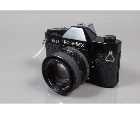 A Rolleiflex SL35 Camera, shutter working, meter responsive, self timer switch jammed, body G, light wear, with Rollei HFT 50