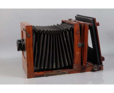 A Large Wooden Studio Tailboard Camera, originally 9 x 9in, adapted for whole plate use, body F, heavy wear, square-cornered 