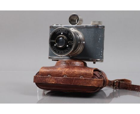 A Tahbes Synchrona 120 Camera, No B 2364, shutter working, with chrome top and base plate, grey leatherette body, body G, som
