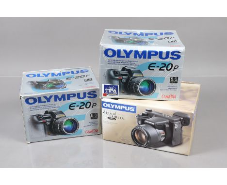 Five Olympus Camedia Digital Cameras, a Camedia E-10 and Four Camerdia E-20, all in maker's boxes, E-10 no manual present, G-