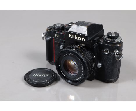 A Nikon F3 SLR Camera, serial no 1814468, shutter working, meter responsive, self timer working, body F, brassing to edges, w