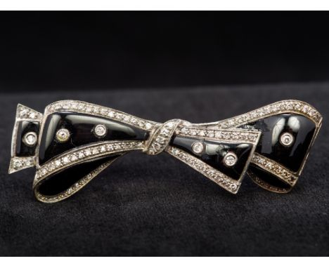 An 18 ct white gold diamond and enamel bar broochFormed as a tied bow.  5.75 cm wide.  CONDITION REPORTS: Some chips/surface 