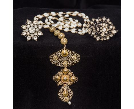 An unmarked yellow metal filigree mounted diamond set pearl necklaceTogether with two paste set brooches.  The former approxi