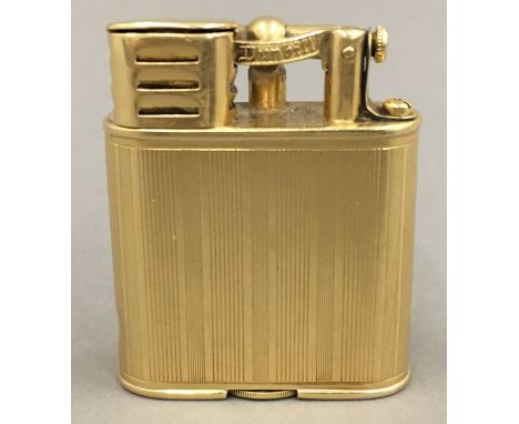 A Dunhill 18 ct gold plated lighter, signed Alfred Dunhill, Paris and patent number 1437525.5 cm high.  CONDITION REPORTS: Va