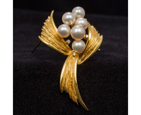 A pearl and diamond set 750 gold broochWorked as a fruiting spray.  5.5 cm wide.  CONDITION REPORTS: Generally good, with exp