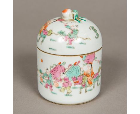 A Chinese famille rose porcelain box and coverOf circular section, worked with figures in a continuous landscape, the domed c